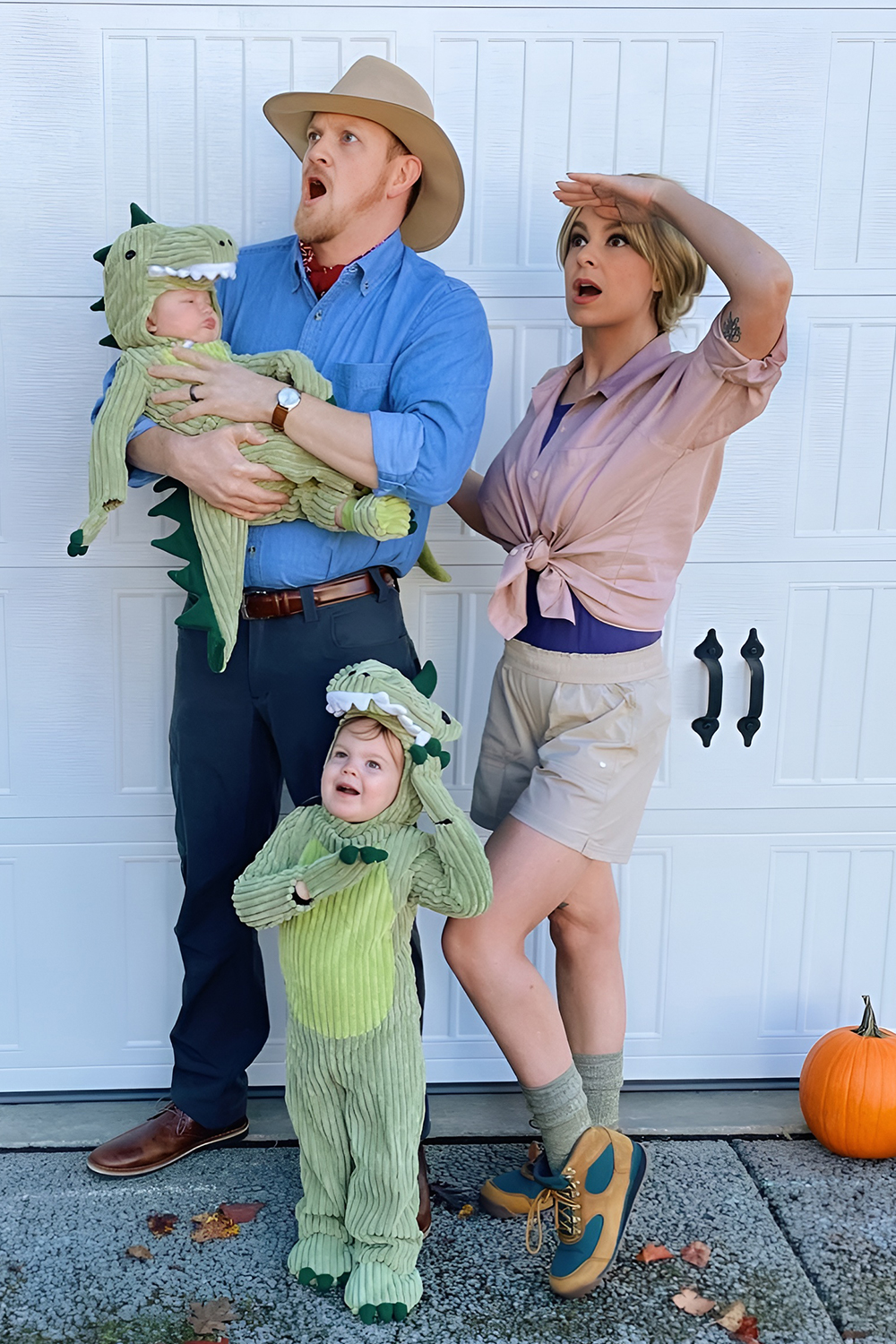 Family in dinosaur costumes for a dino themed Halloween