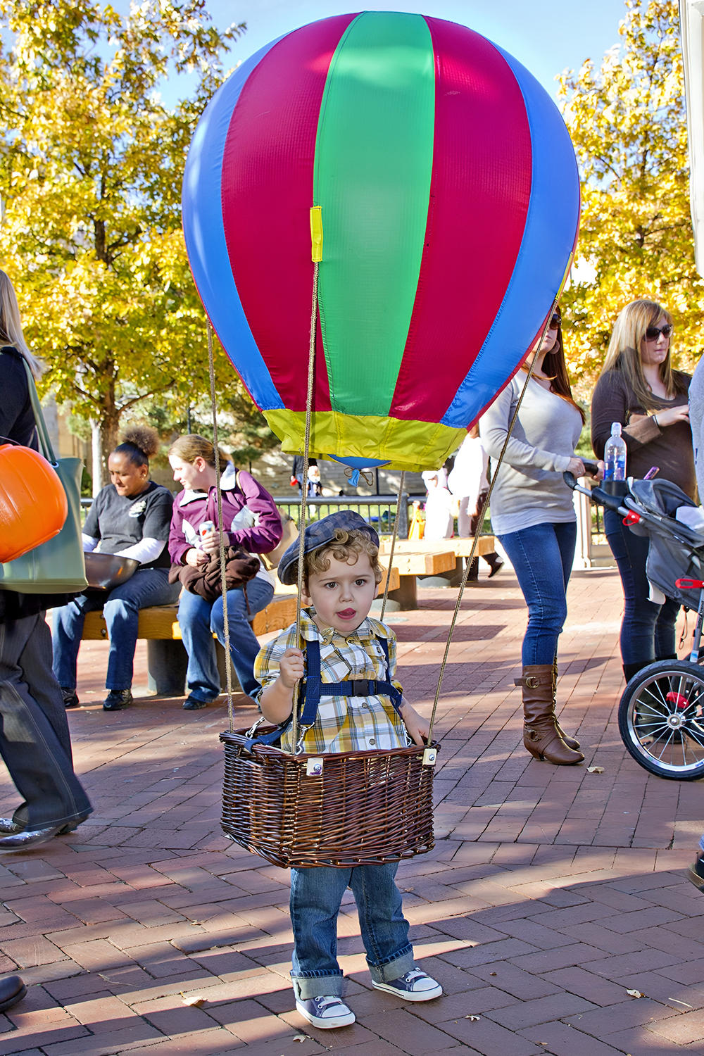 Family hot air balloon costume with the stroller as the balloon basket