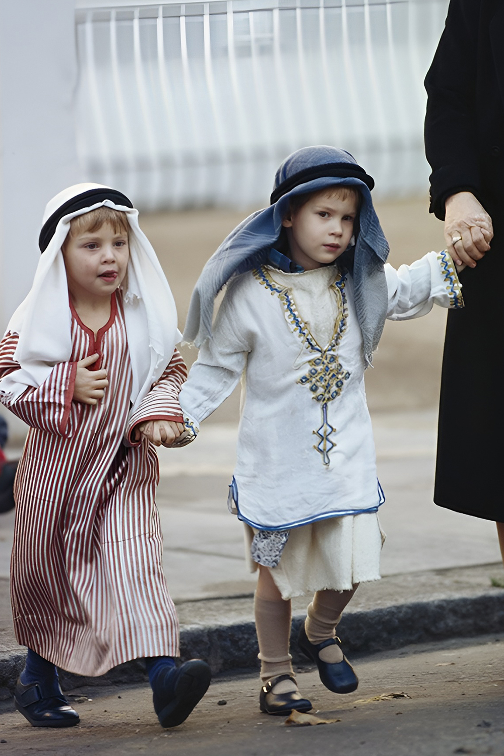 Family dressed as royalty with the baby wearing a tiny crown