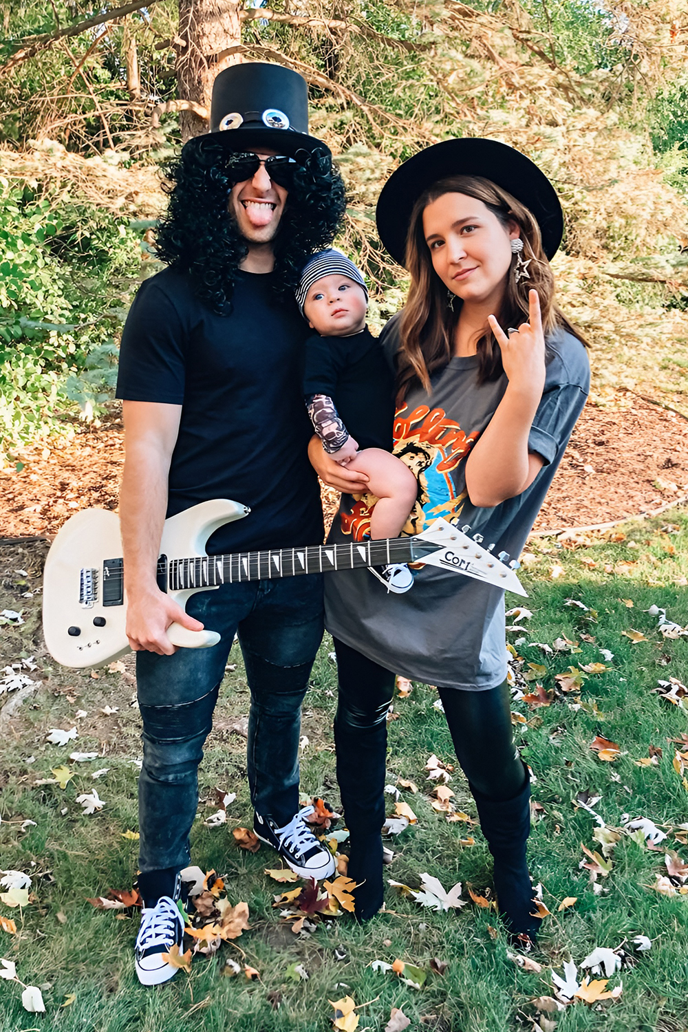 Family rock band costumes with the infant as the star drummer