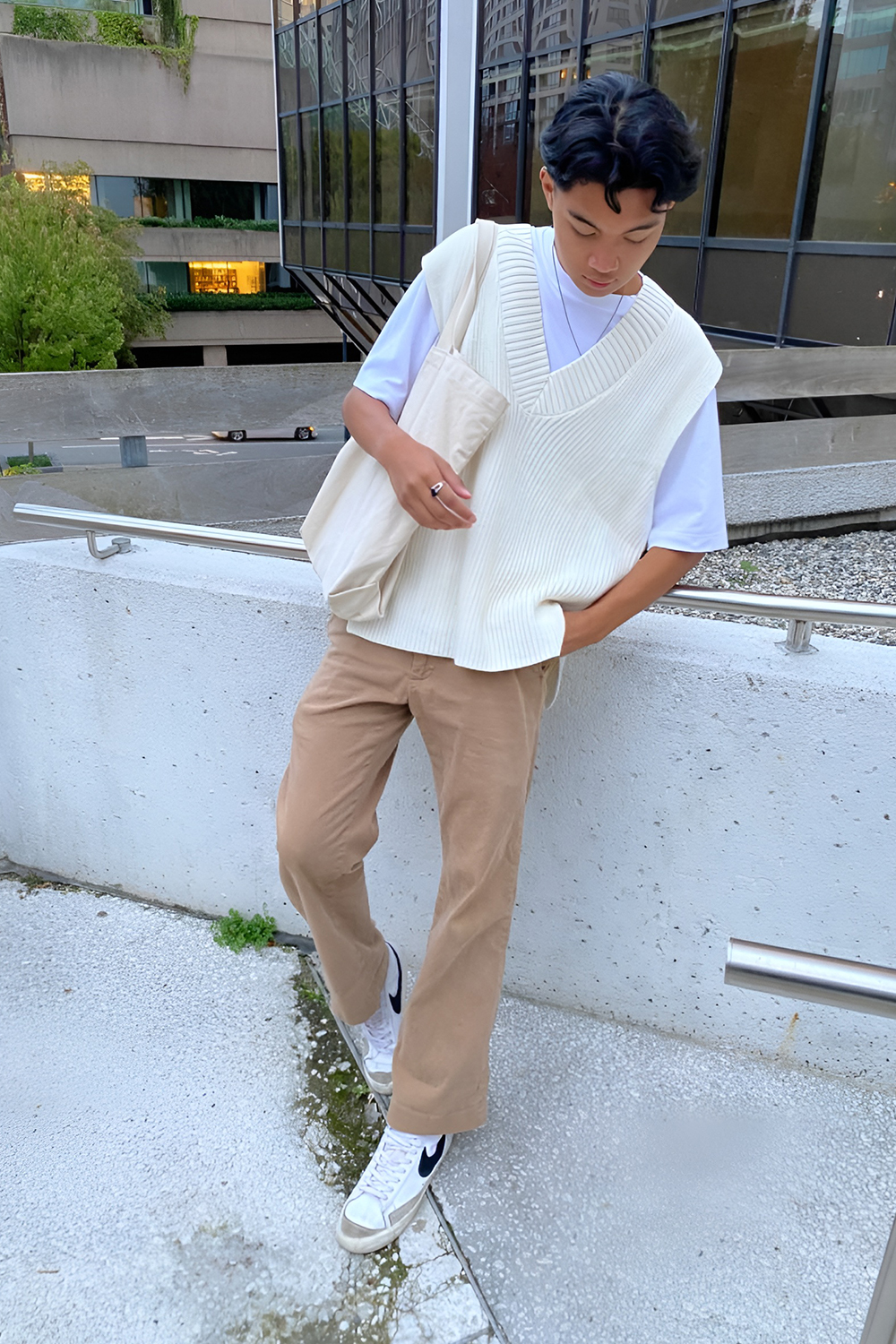 Sweater Vest with Striped Pattern and Neutral Trousers